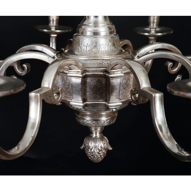 This is a beautiful antique English silver plated eight light chandelier, circa 1920 in date. The silver-plated chandelier...