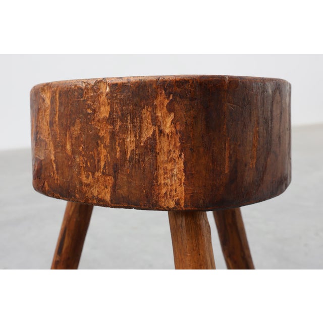 A wonderfully primitive French tripod stool crafted from solid oak, dating from the early twentieth century. Defined by...