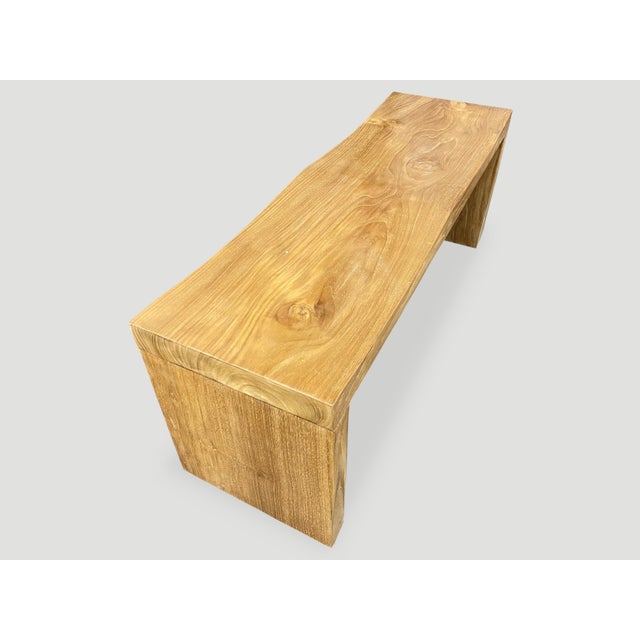 The teak wave bench represents a sleek, modern aesthetic, designed to provide comfort and durability. A solid single slab...