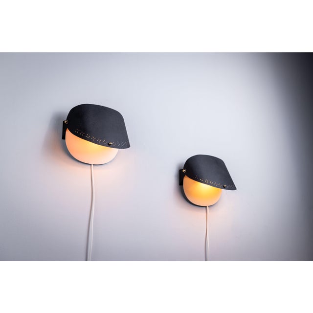 Introducing our versatile set of black wall lamps, designed to elevate any space with both style and function. These lamps...