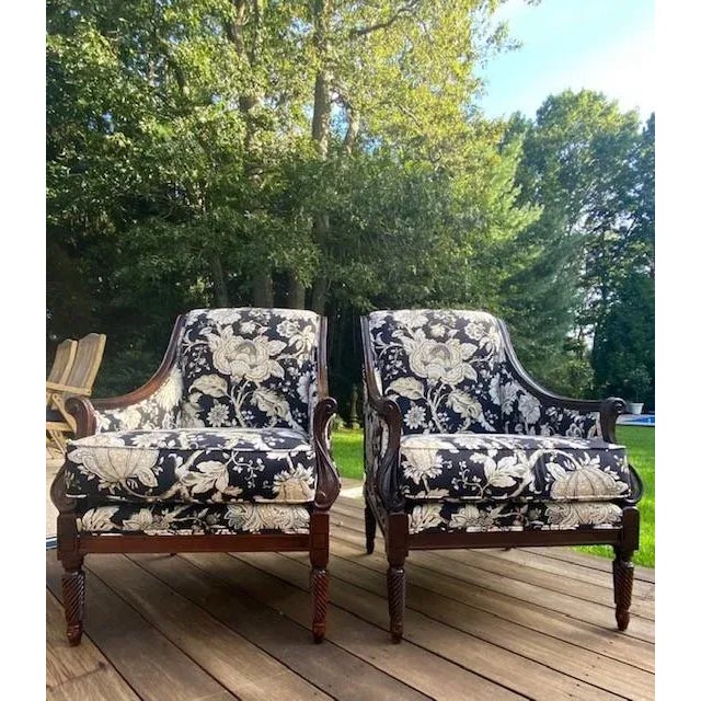 A Pair of Custom Upholstered Lounge Chairs A stunning pair of Custom upholstered lounge chairs features flowing lines and...