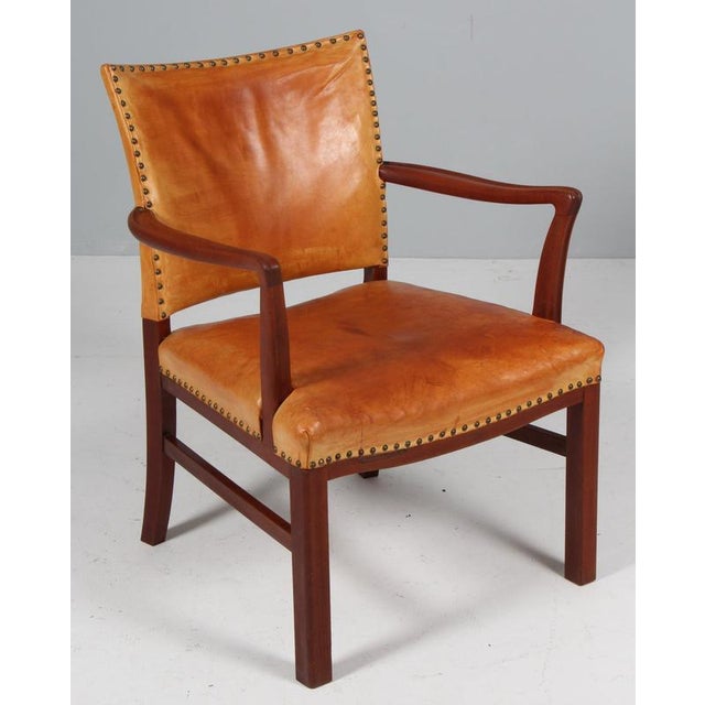 Polexim armchair in style of Kaare Klint. Frame of mahogany. Upholstered with patinated nature leather. with brass nails....