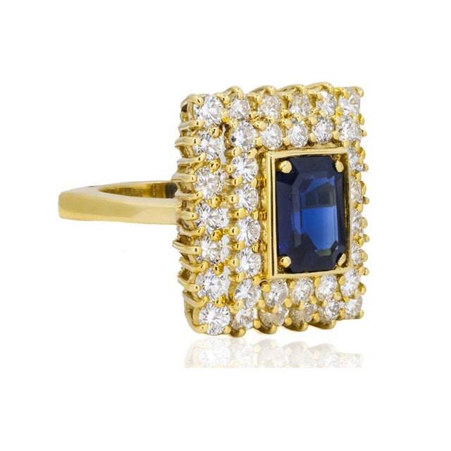 18K Hand fabricated ring by Keith Davis emerald cut sapphire weighing 2.41 carats and 40 round diamonds weighing 3.06...