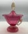 The Murano Cranberry Glass Neo Classical Lidded Jar is an exquisite piece of antique glass craftsmanship originating from...