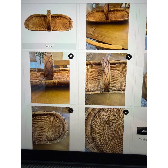 Antique Chinese harvest rice basket made from split reeds and a bent wood handle secured with iron straps. It is extremely...