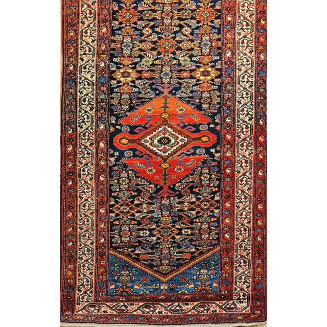 3’ x 20’ Rare and highly desirable vintage Persian Malayer long runner woven in the first quarter of the 1900s has a...