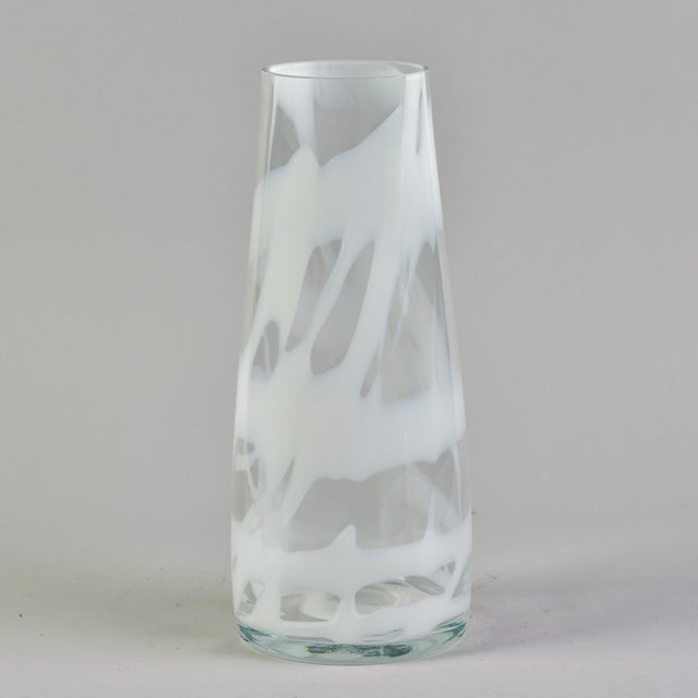 Found in Italy, this Murano glass vase dates from approximately 2000. This vase is quite tall and stands just under 16”....