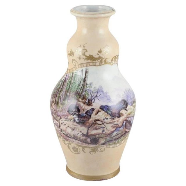 Royal Copenhagen. Colossal porcelain vase. Motif of two wood grouses (Tetrao urogallus) in a forest landscape, gold...