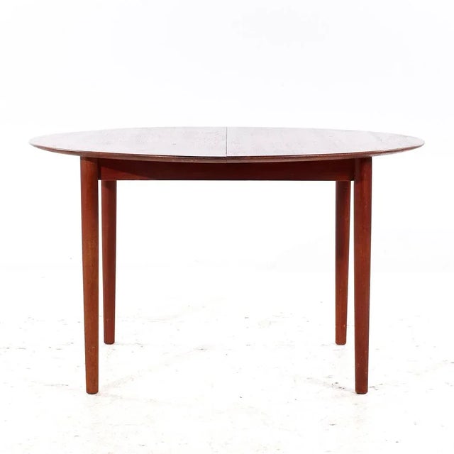 Moreddi Style Mid Century Danish Teak Expanding Dining Table with 1 Leaf This table measures: 49 wide x 45.5 deep x 29...