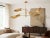 A handcrafted solid brass mobile chandelier featuring six adjustable sculptural shades arranged along a balanced...