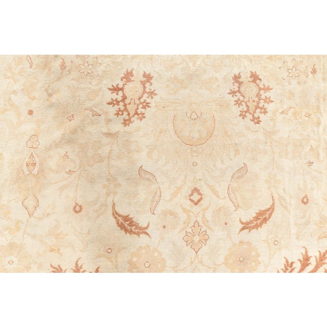 A late 19th century Indian Amritsar antique rug from our exclusive Amritsar rugs gallery collection, the cream field with...