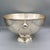 A vintage silverplate champagne bath (also suited as a punch bowl), standing on a footed pedestal base with dual ring...