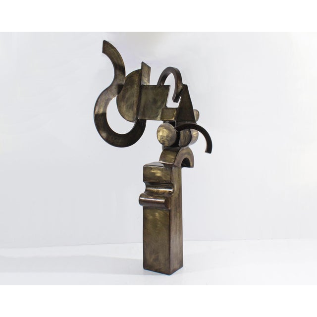 A Cubist style sculpture by the American artist Robert Beaven (born 1929). Made of patinated steel, this sculpture depicts...