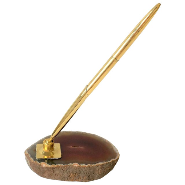 A '70s modern brass and onyx/agate desk pen holder. Onyx/agate is a red burgundy. Pen is in fine working order. A great...