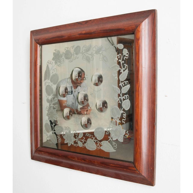 A spectacular English bullseye mirror, with engraved plate, from the latter part of the 19th century. This wonderful...