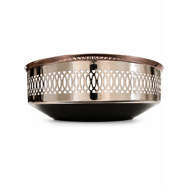 Elegant vintage bread basket featuring a polished silver-tone finish unmarked with a decorative pierced openwork border...