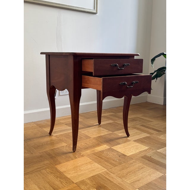 Graceful Ethan Allen two-drawer side table with classic French Provincial/Queen Anne lines—rounded corners, scalloped...