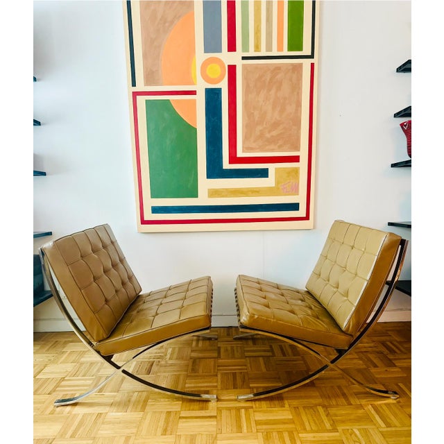Stunning pair of vintage light caramel Barcelona chairs with matching footstools designed by Mies Van Der Rome in 1929 and...