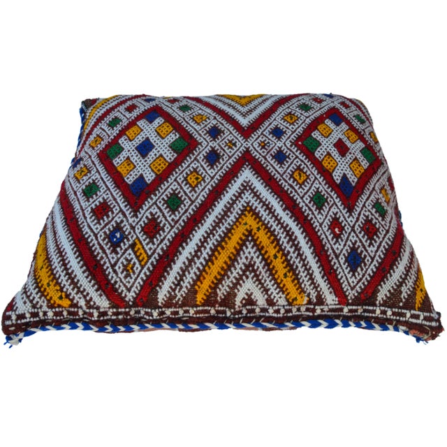Antique handwoven pillow by the Berbers of the High Atlas Mountains of Moroccan. Features a finely-woven design consisting...