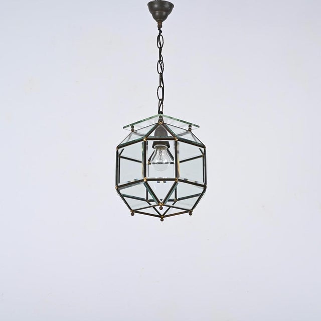 Fabulous pendant in beveled glass and brass. This gorgeous piece was designed in the 1950s and is attributed to Fontana...