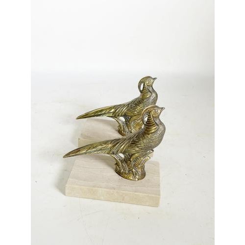 Pair of rooster-shaped bookends, France, 1950s, combining elegance and character. Composed of finely detailed brass...