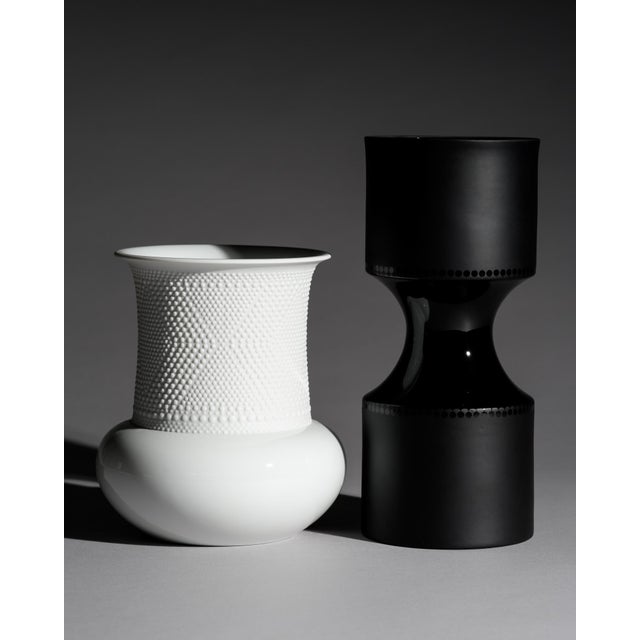 Curated porcelain vase duo designed by Tapio Wirkkala for Rosenthal Studio-Line, combining two contrasting forms in black...