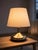 Swedish Brass Table Lamp, 1970s - Top Lighting Year: 1970, Sweden Materials: Brass and beige fabric shade Condition: Very...