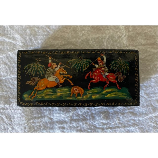 Here’s a lovely little specimen to add to your Palekh box collection. The whimsical hand-painted scene depicts two riders...