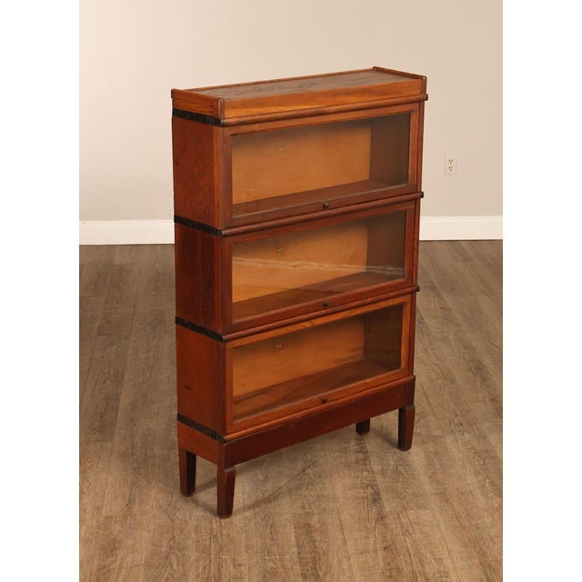 High Quality Antique Early 20th Century Oak Three Stack Barrister Bookcase with Pocket Glass Doors Mounted on Raised Base