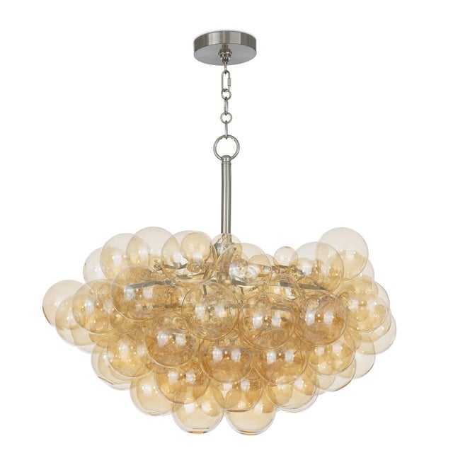 The Bubbles Chandelier is a true masterpiece of modern design that blends whimsy and sophistication. It features a cluster...