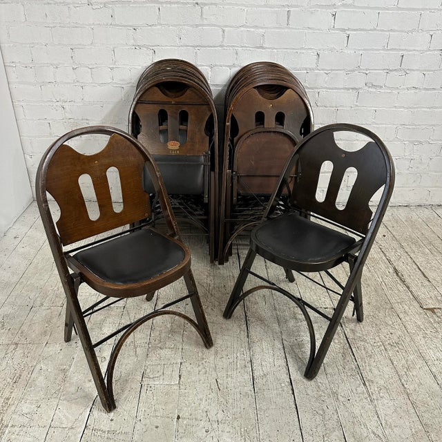 Antique wood folding chairs that came out of a Masonic temple made in the USA