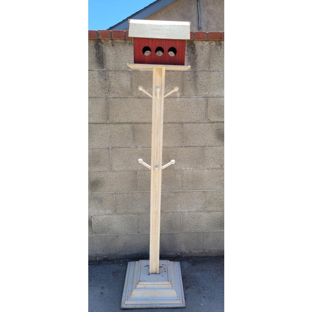 Vintage Folk Art Barn House Coat Rack with Eights pegs to hold coats. Colors: off white and red with a brown roof. Great...