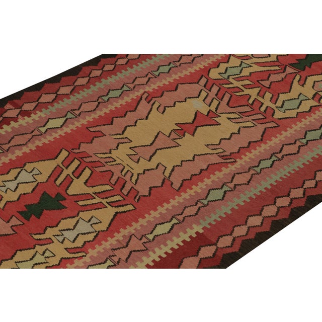 This vintage 5x10 Persian kilim is a rare rug with an unusual design in its origins—handwoven in wool circa 1950-1960....