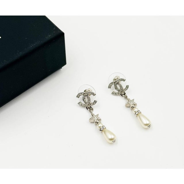 Contemporary Chanel Brand New Silver CC Crystal Star Tear Drop Pearl Piercing Earrings, A Pair For Sale - Image 3 of 6
