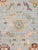 Expertly hand-knotted from fine wool, this Turkish Oushak rug showcases the collection's signature large-scale semi-...