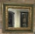 AVAILABLE IMMEDIATELY A striking Paul Ferrante Alana mirror featuring a hand-finished 22-karat gold leaf frame with an...