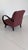 Comfortable club chair with curved armrests made of lacquered wood. The understated design stylishly complements a modern...