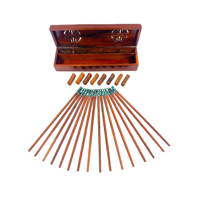 A beautiful handmade set of chopsticks finished in a warm, natural wood grain complemented by striking green and ivory...