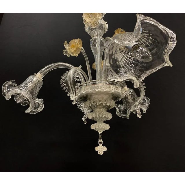 Beautiful chandelier with transparent color and gold. Handmade by the Master of the Toso company Toso in the 1980s; The...