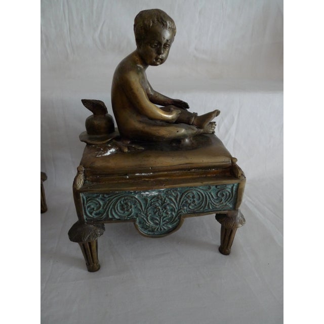 Title: Bronze Recumbent Hermes Child Statues - a Pair. Period: 19th Century. Maker: Unknown (unmarked). Material: Bronze....