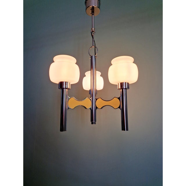 Space age 3-arm chandelier in chromed metal and white opaline glass, designed by gaetano sciolari for the belgian...