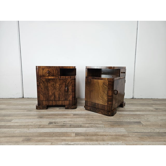 Pair of unique 1940s Art Deco bedside tables, entirely clad in walnut burl, with a drawer and storage space underneath....