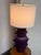 Design Plus Gallery presents a Purple Ceramic Table Lamp. This ceramic lamp has a purple glaze over a raised geometric...