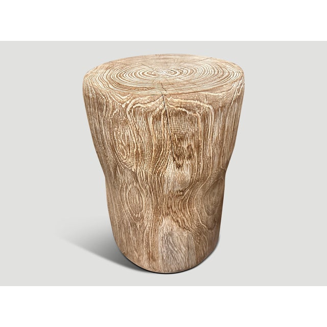 Hand carved cerused teak side table or stool with a subtle hourglass shape. Celebrating the cracks and crevices found in...