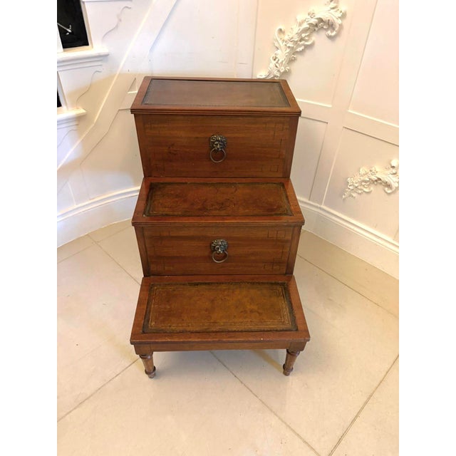 A fine set of antique George III mahogany library steps of compact three-step form constructed in solid mahogany and...