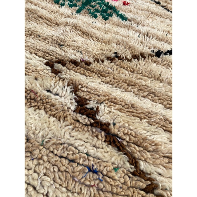 Hand-woven by the Berber women in the Atlas Mountains, this Vintage rug is created with soft natural wool fibers from the...