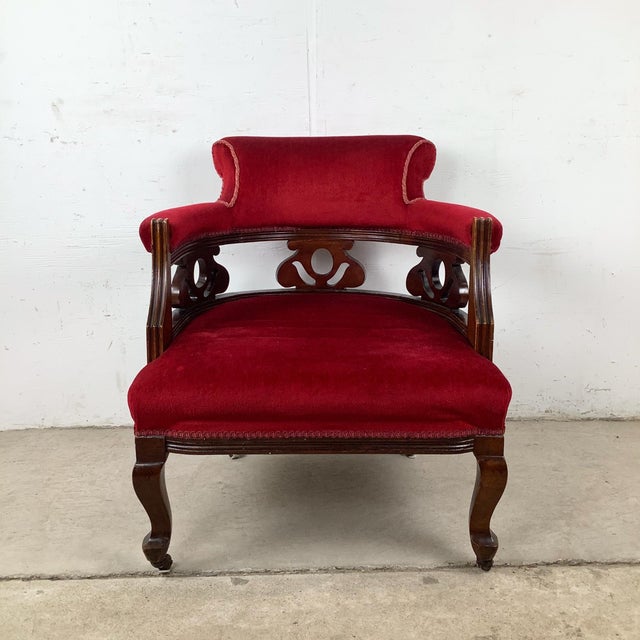 This vintage upholstered armchair brings classic Empire Revival influence into a highly livable, sculptural form. With its...