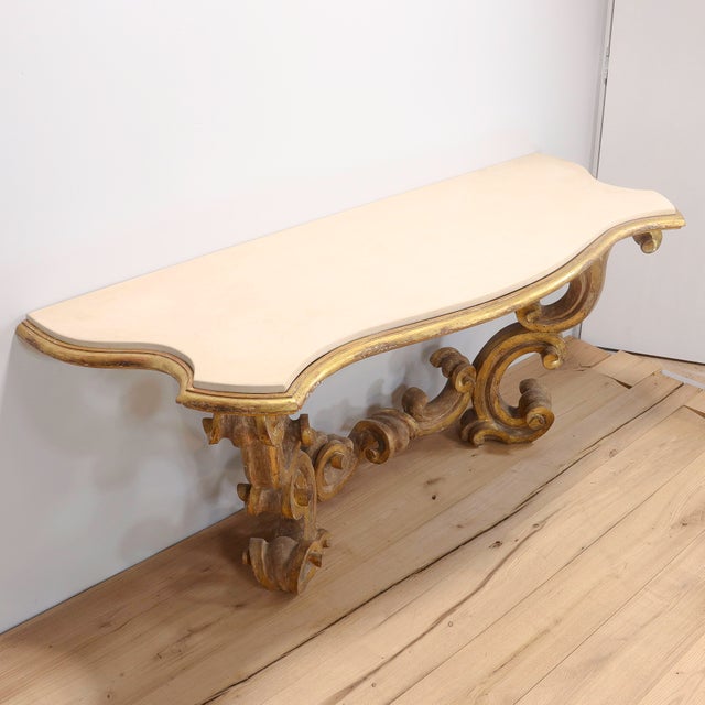 A fine custom made Louis XV or Rococo style table. With a gessoed and gilt wooden base in the high Rococo style with...