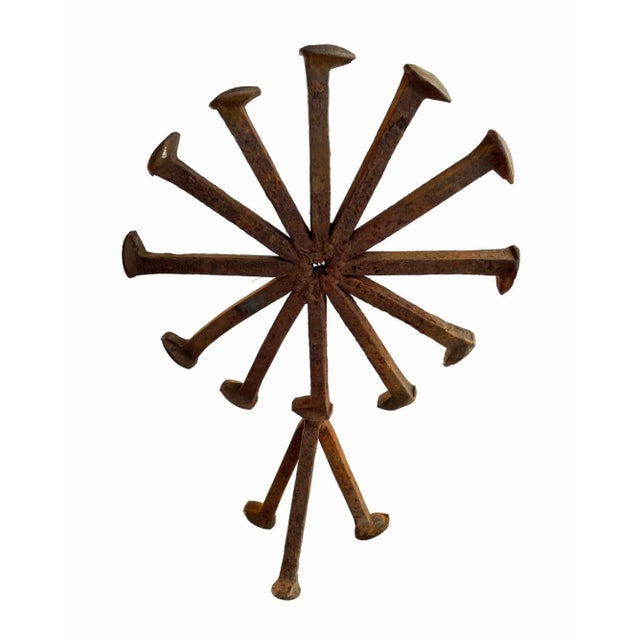 Mid-Century abstract folk art sculpture. Constructed from iron railroad ties. Distressed rust finish throughout.