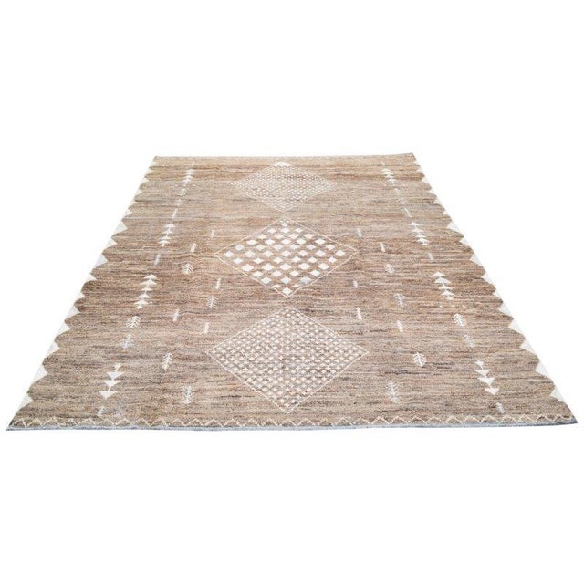 Moroccan Hand-knotted with care using traditional rug-making techniques, this wool rug blends timeless craftsmanship with...